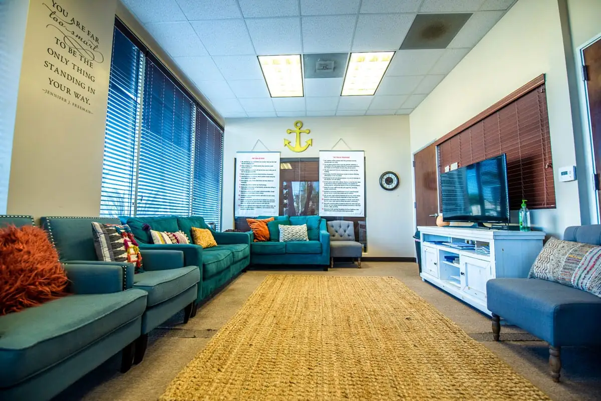 Group therapy room with comfortable seating