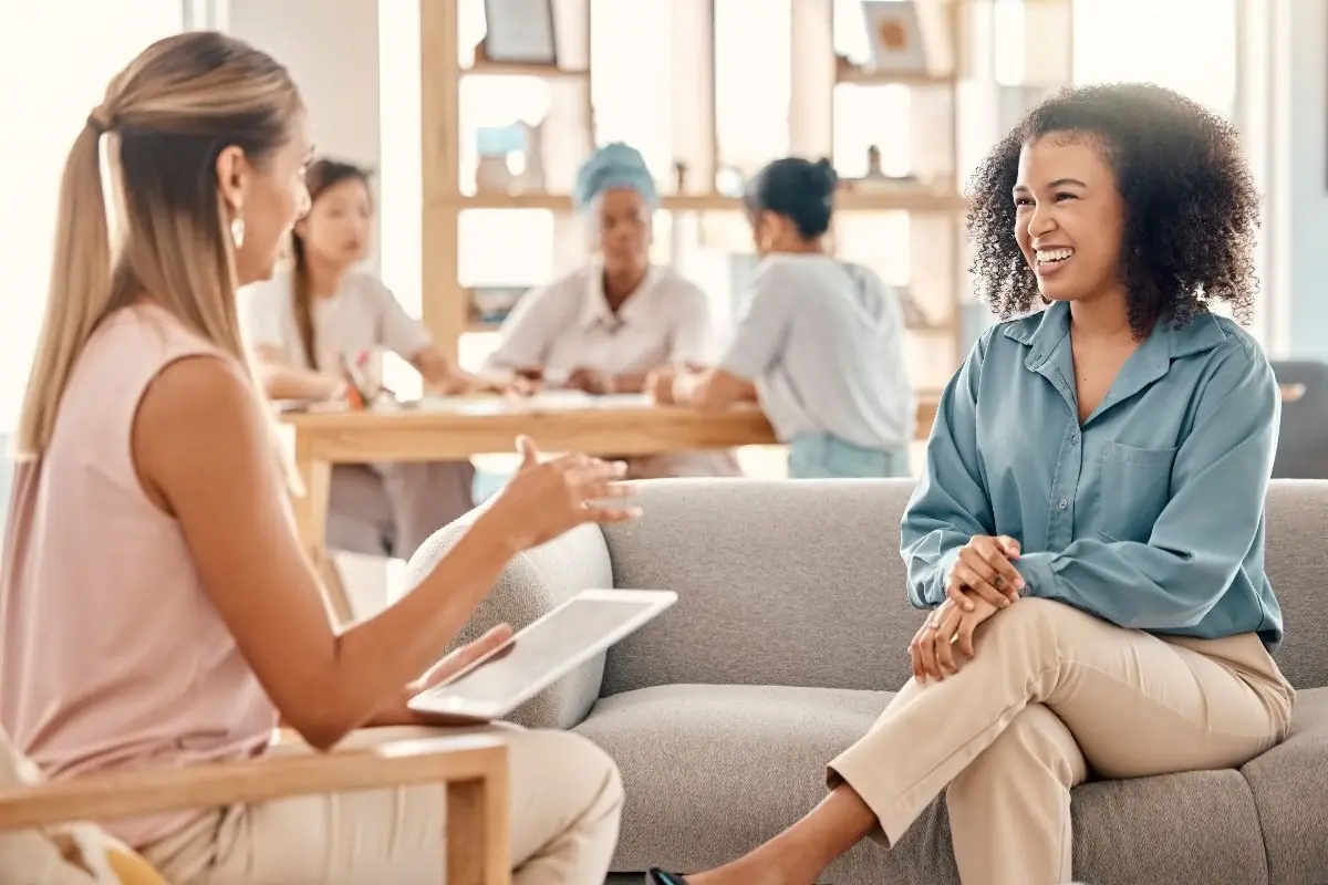 A woman and her counselor in a focused one-on-one outpatient session